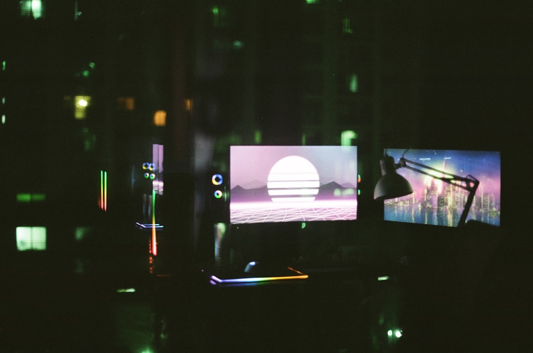 black-flat-screen-tv-turned-on-in-a-dark-room-fdgdflywfq8